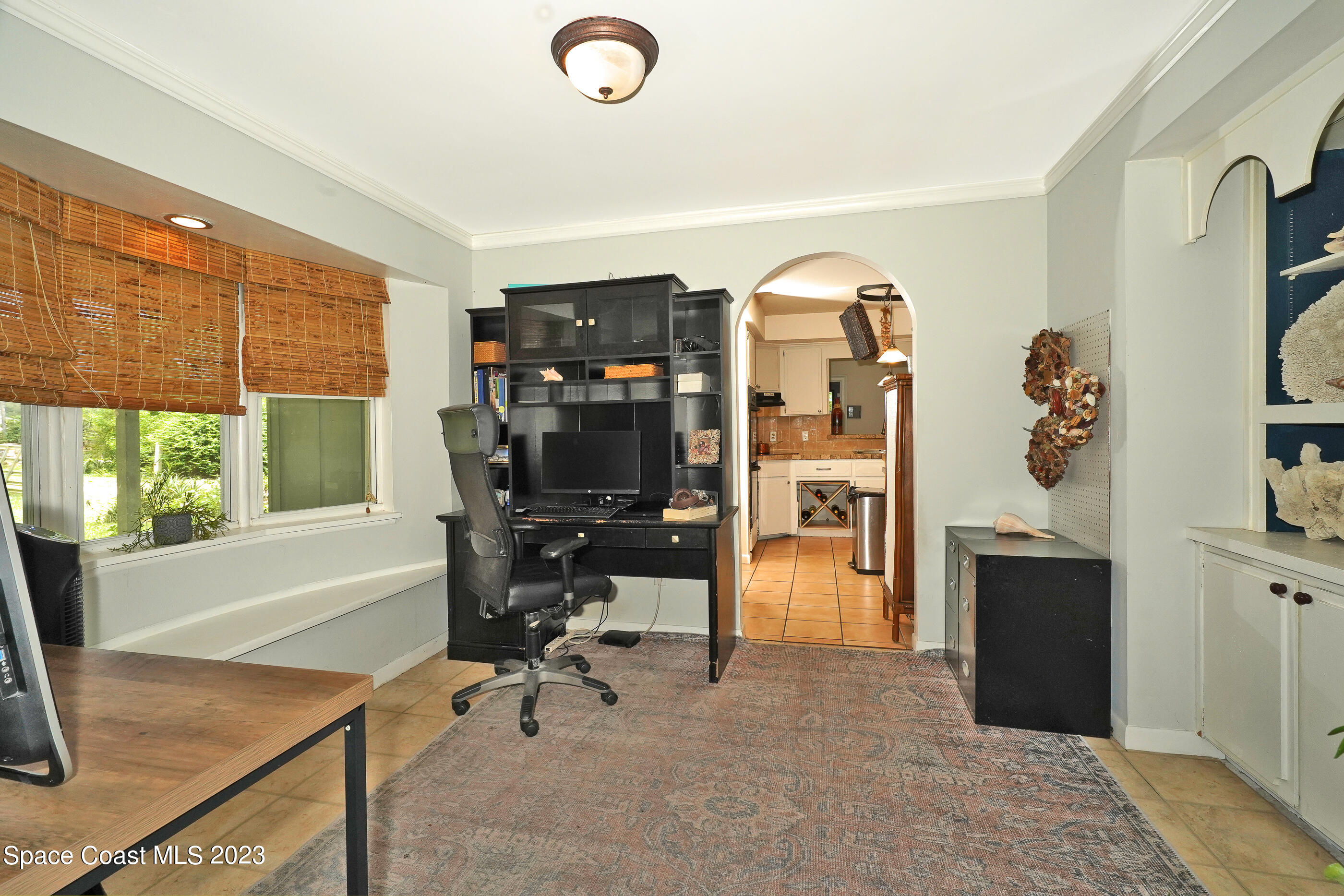 2525 Friday Road Cocoa, FL 32926 - Photo 19 of 77 a view of a workspace with furniture and a window