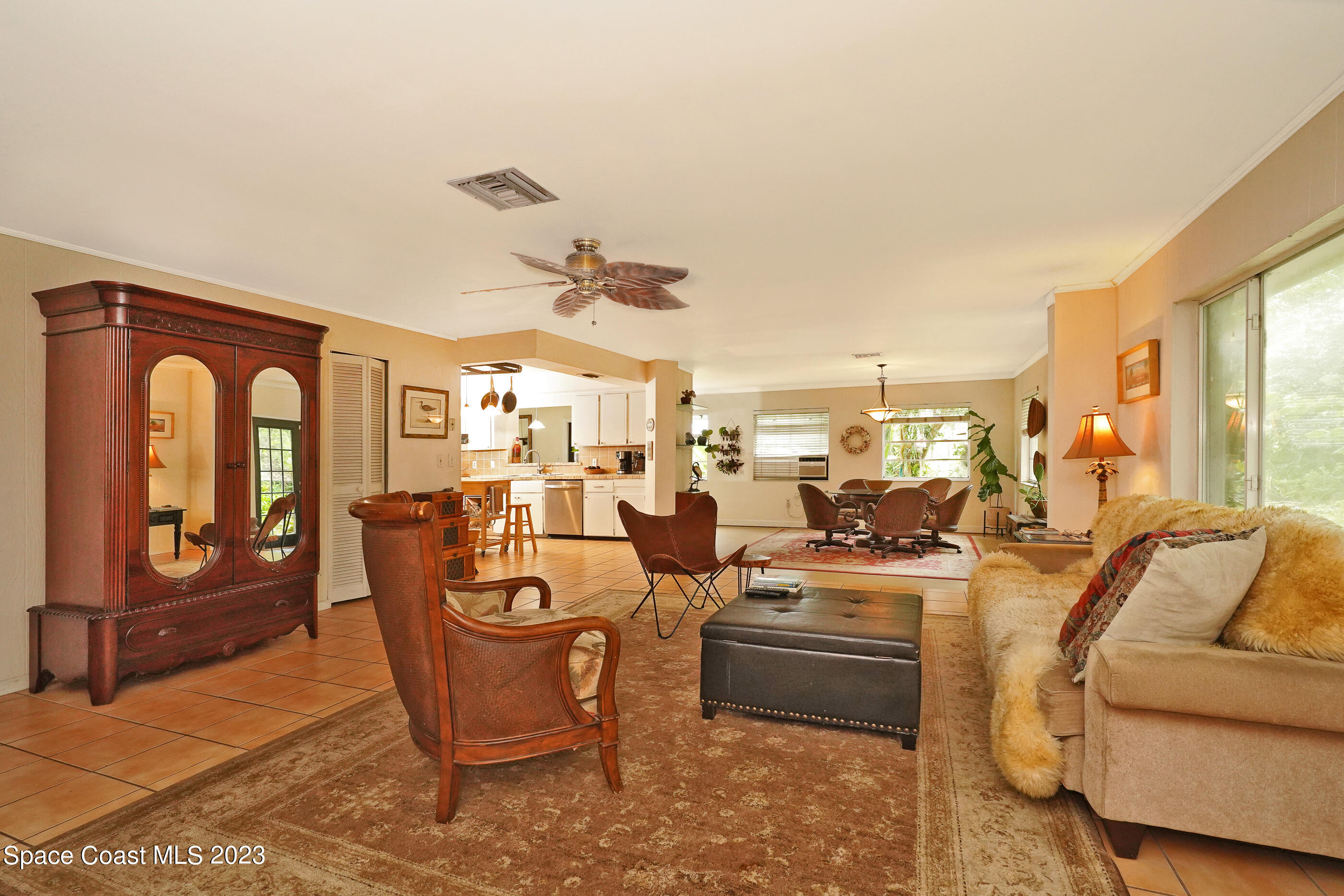 2525 Friday Road Cocoa, FL 32926 - Photo 22 of 77 a very nice looking living room with a large window and furniture