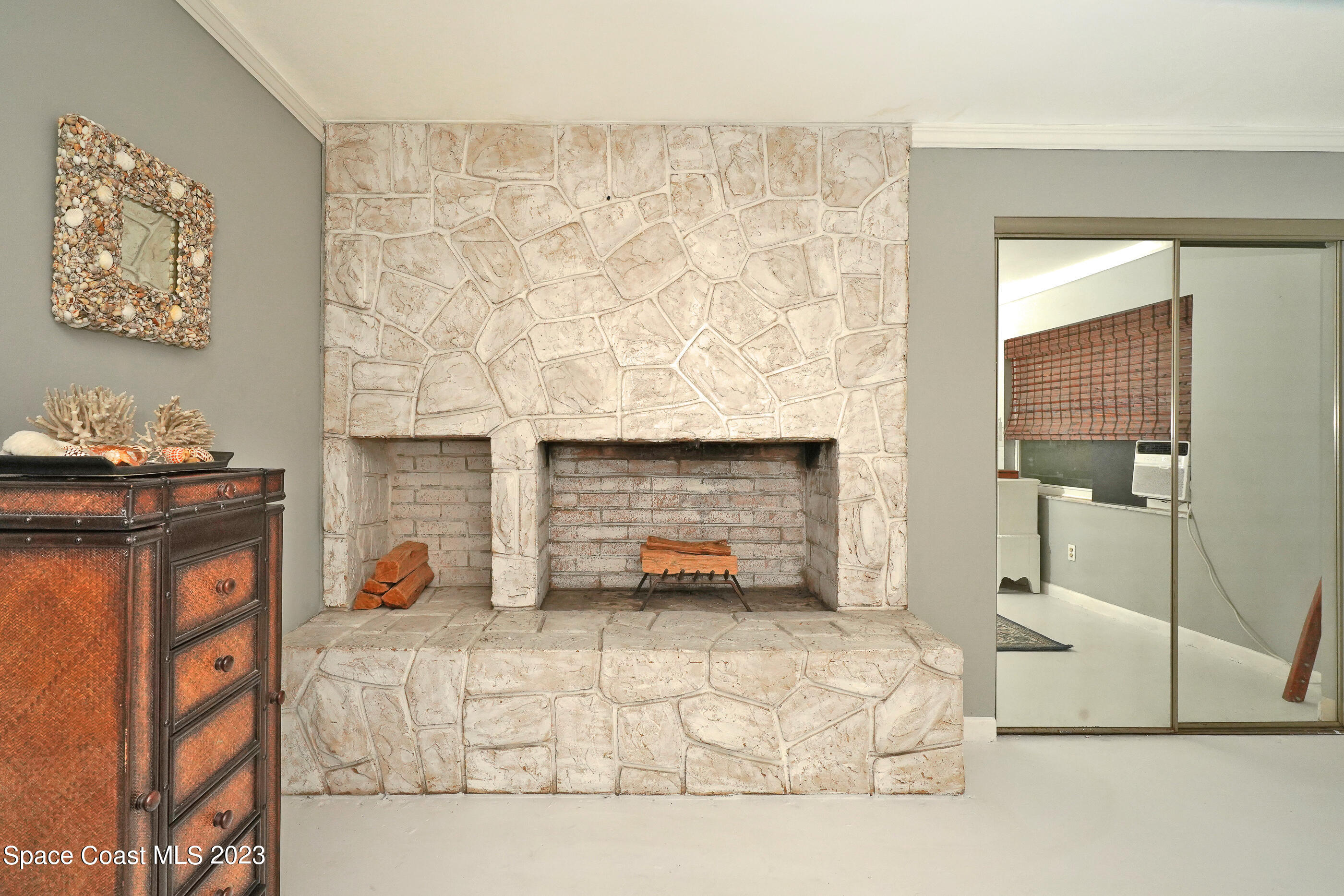 2525 Friday Road Cocoa, FL 32926 - Photo 25 of 77 a living room with furniture and a fireplace