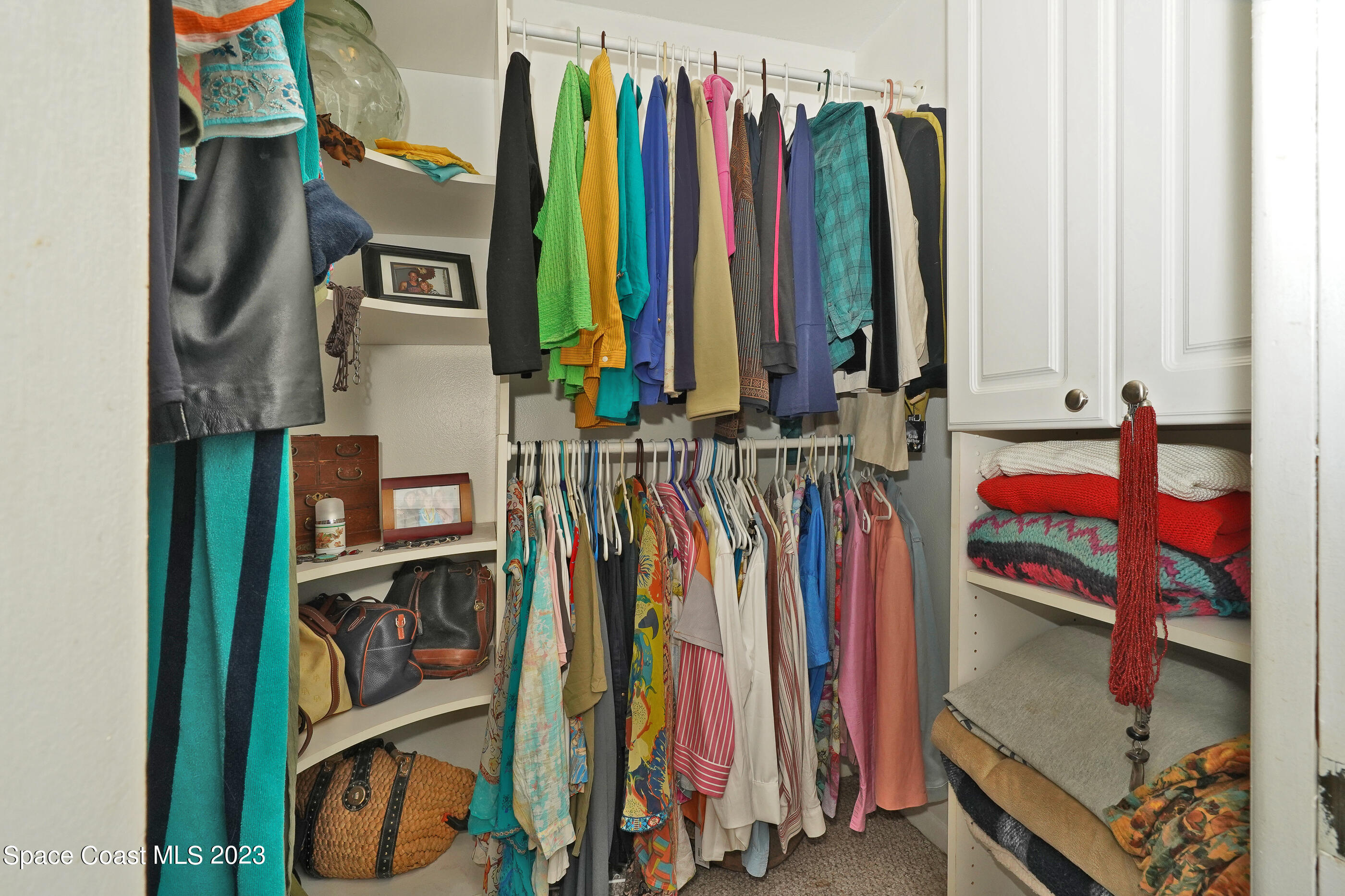 2525 Friday Road Cocoa, FL 32926 - Photo 26 of 77 a view of walk in closet with clothes