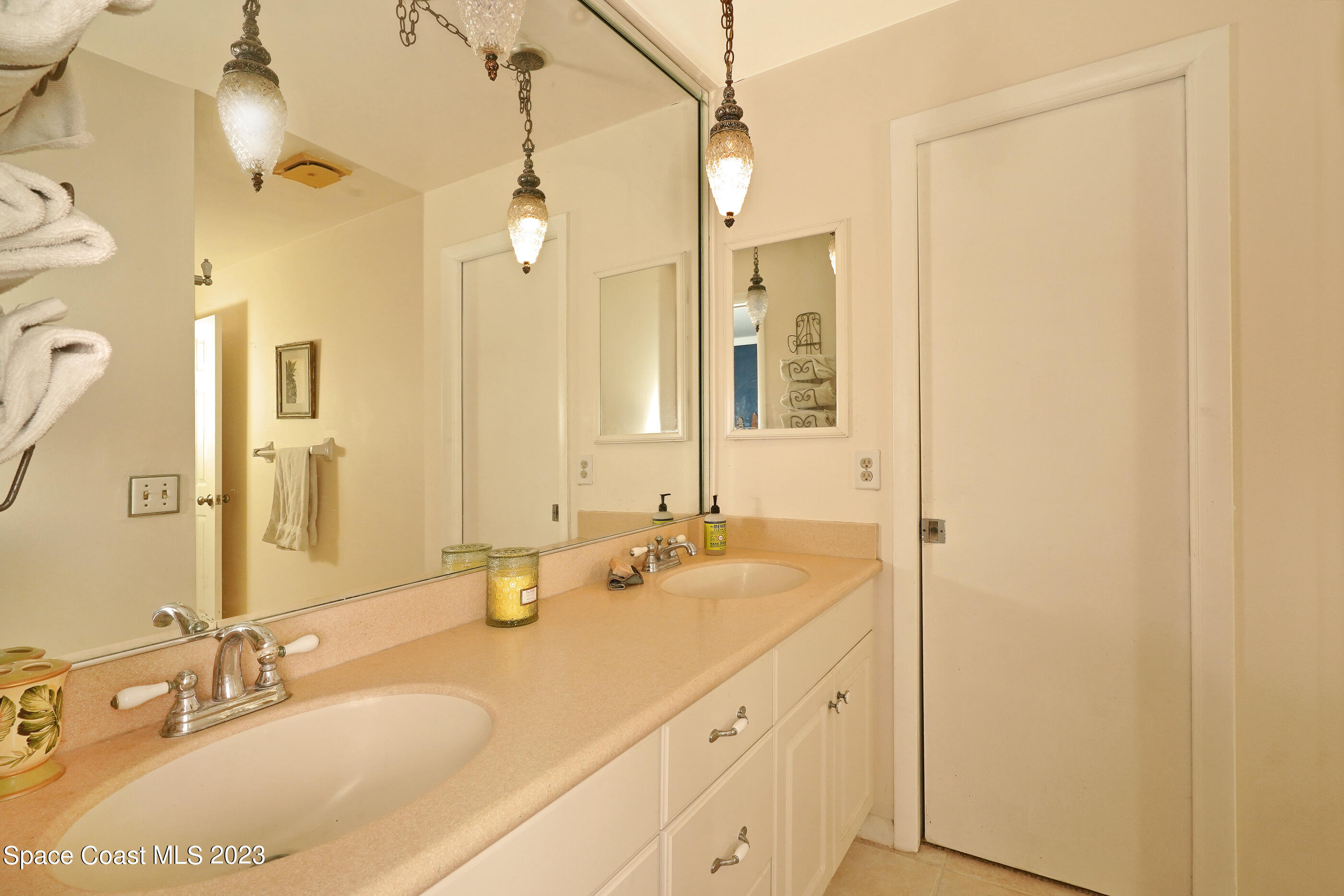 2525 Friday Road Cocoa, FL 32926 - Photo 29 of 77 a bathroom with a granite countertop sink and a mirror