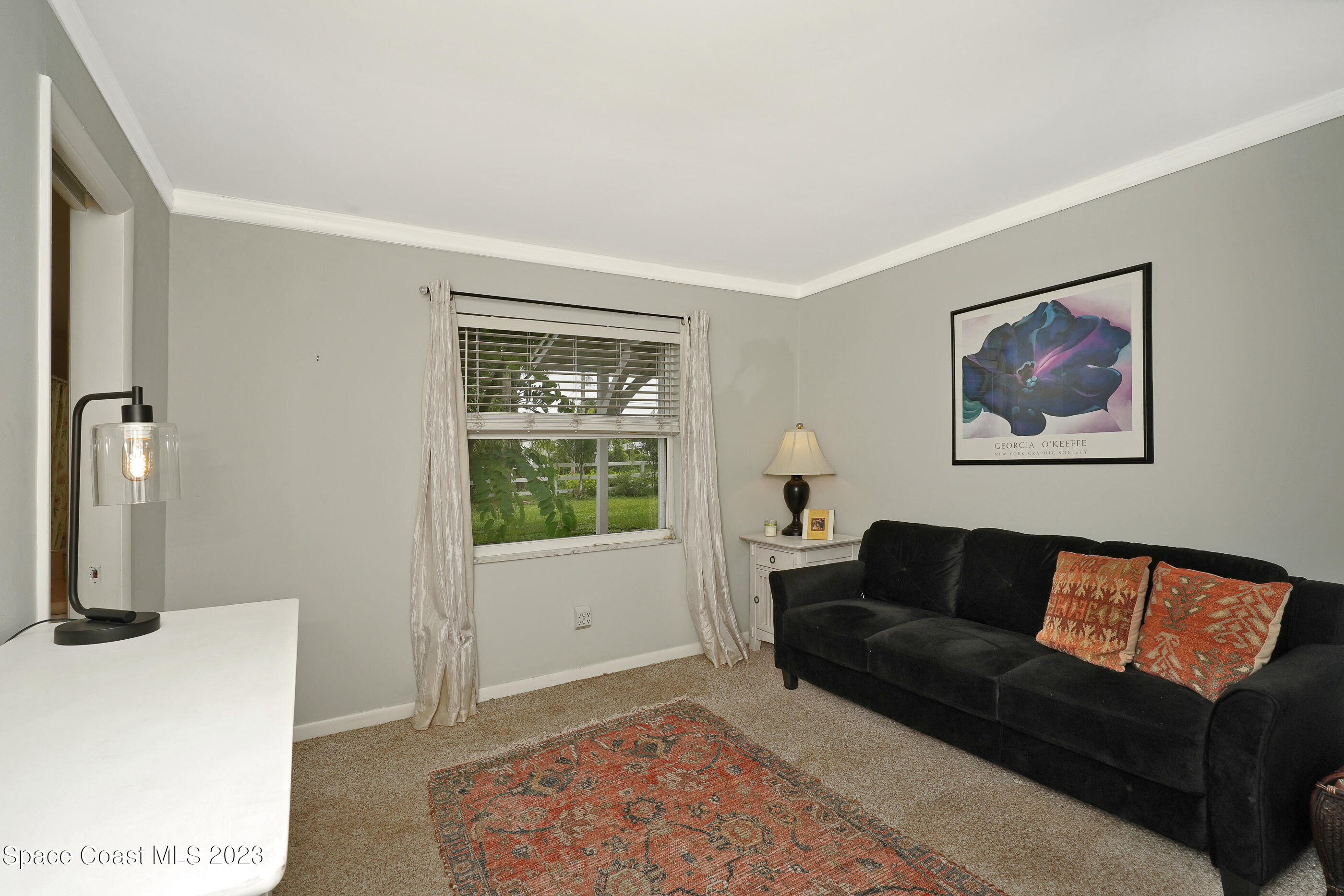 2525 Friday Road Cocoa, FL 32926 - Photo 30 of 77 a living room with furniture and a window