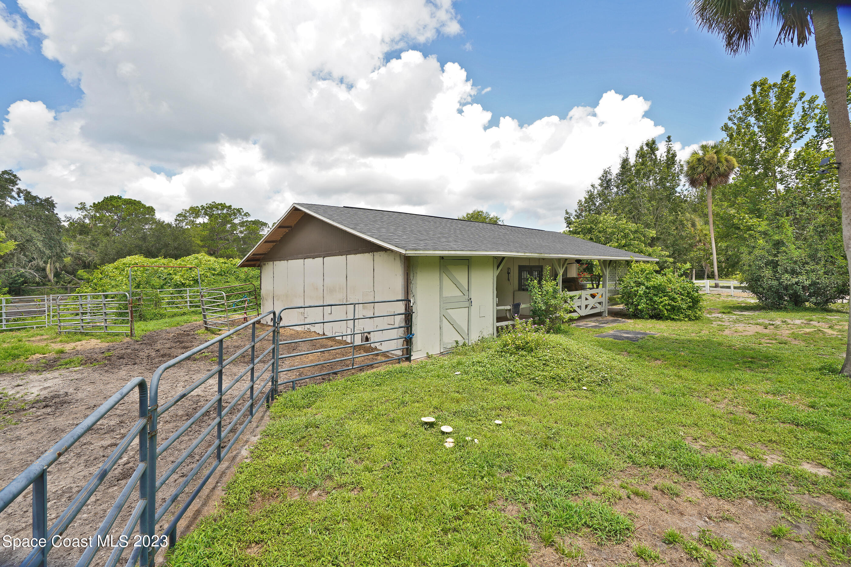 2525 Friday Road Cocoa, FL 32926 - Photo 40 of 77 a view of house with backyard and garden
