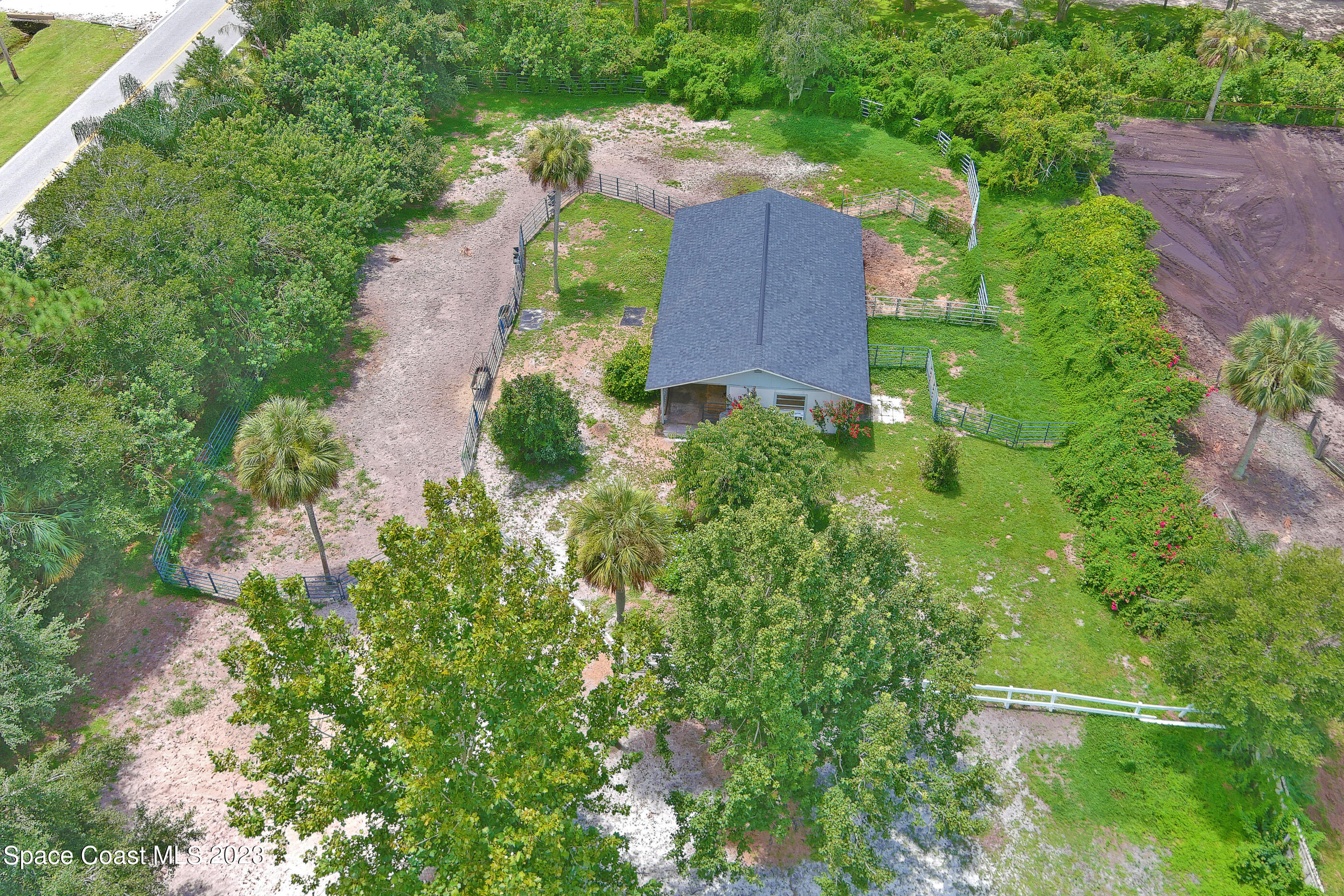 2525 Friday Road Cocoa, FL 32926 - Photo 51 of 77 an aerial view of a house by greenery space
