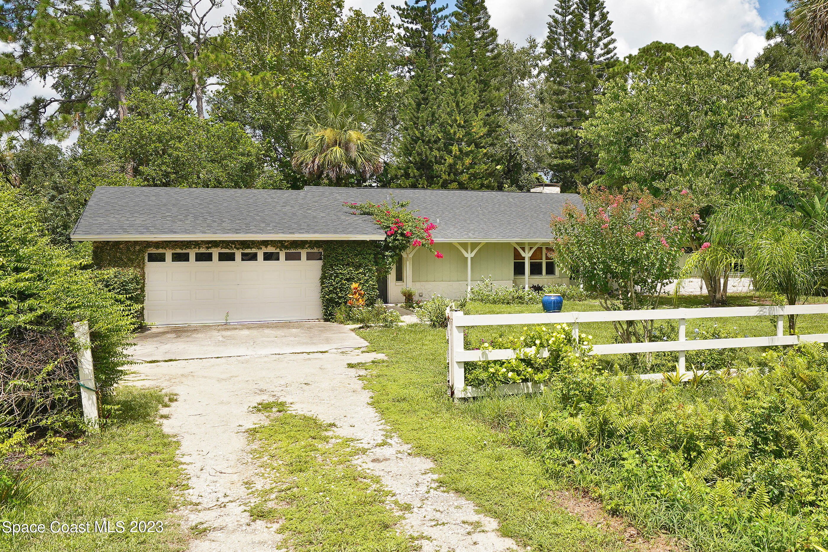 2525 Friday Road Cocoa, FL 32926 - Photo 62 of 77 a view of a house with pool and a big yard