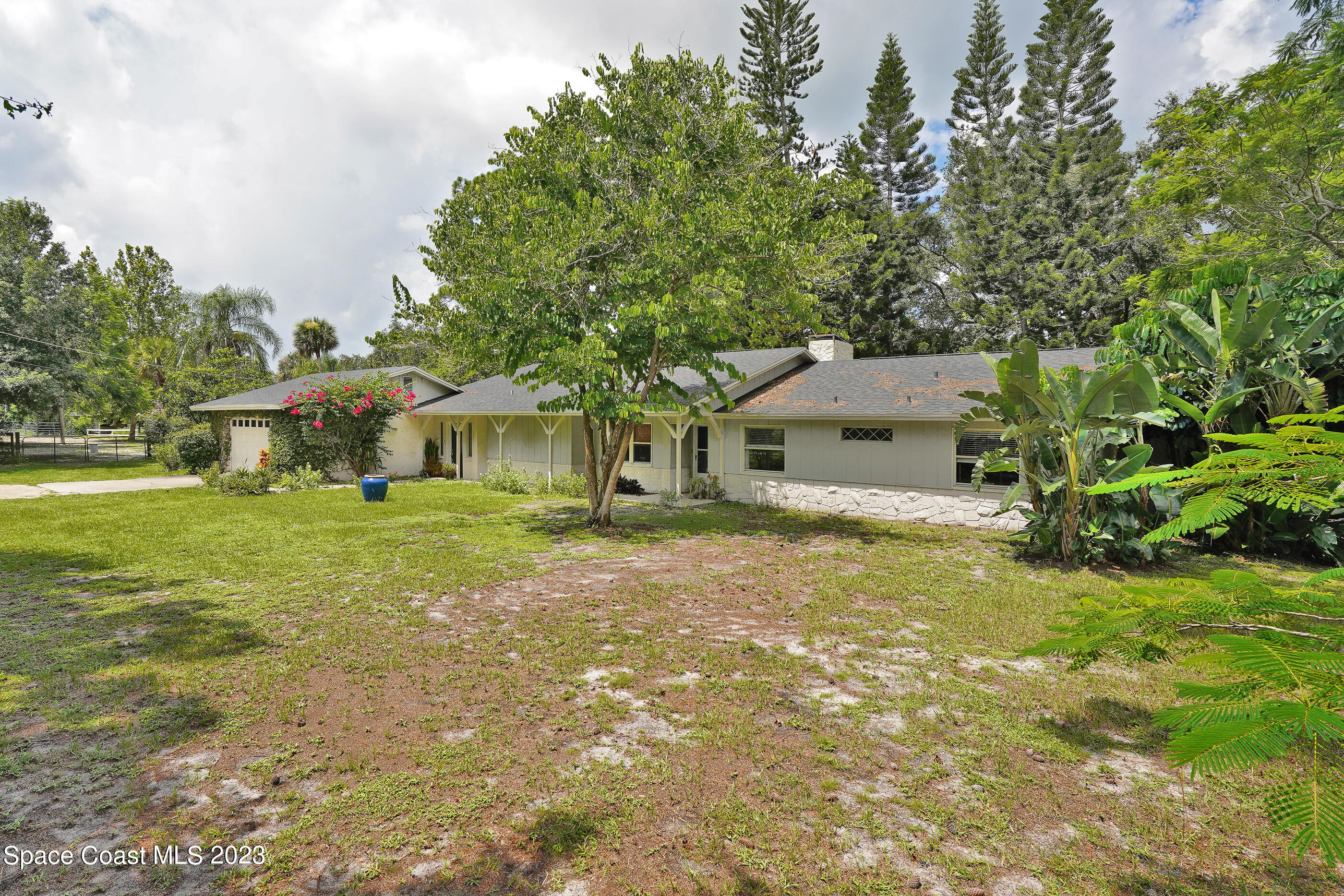 2525 Friday Road Cocoa, FL 32926 - Photo 63 of 77 a front view of a house with garden