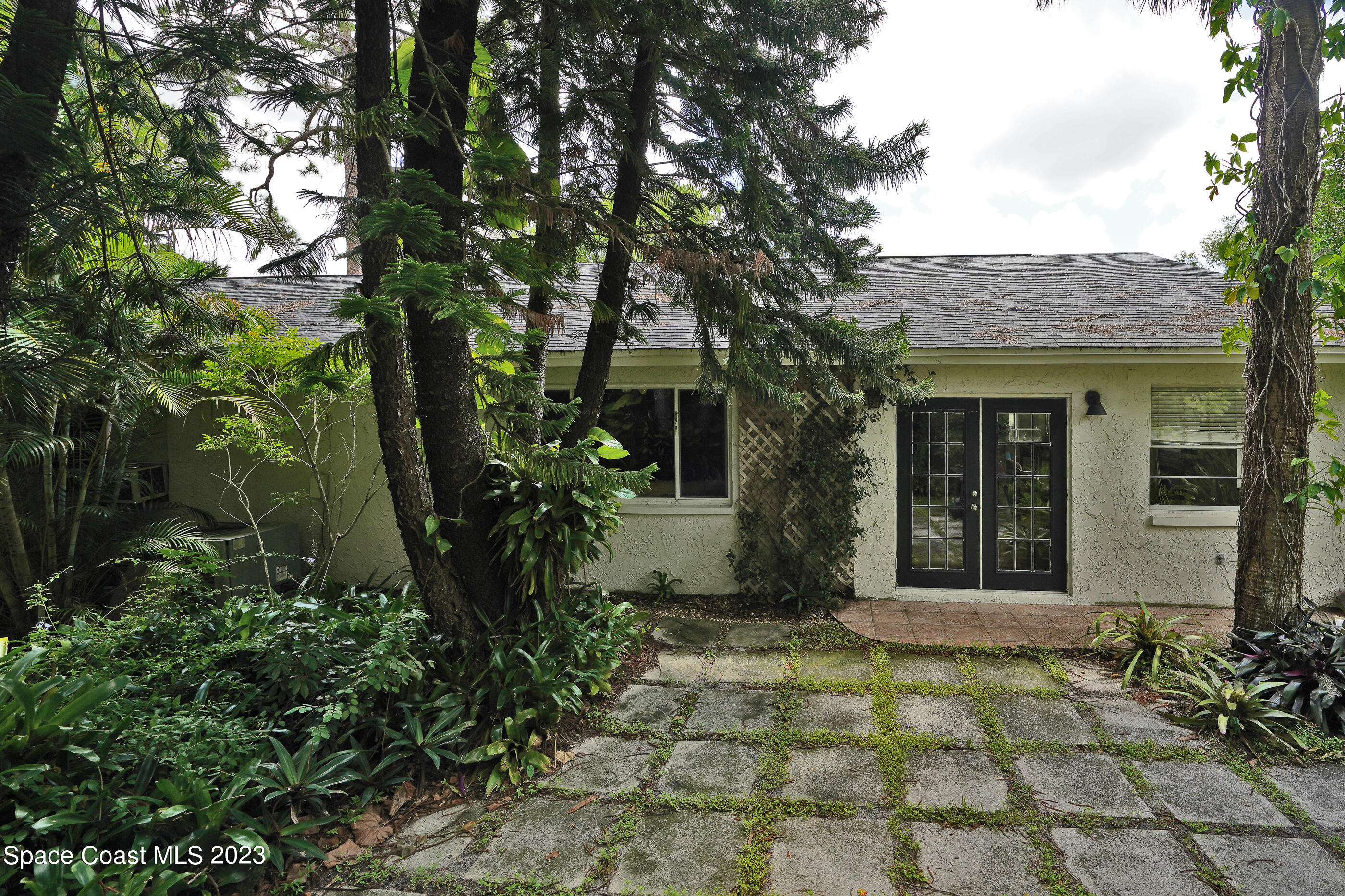 2525 Friday Road Cocoa, FL 32926 - Photo 73 of 77 a house with trees in front of it