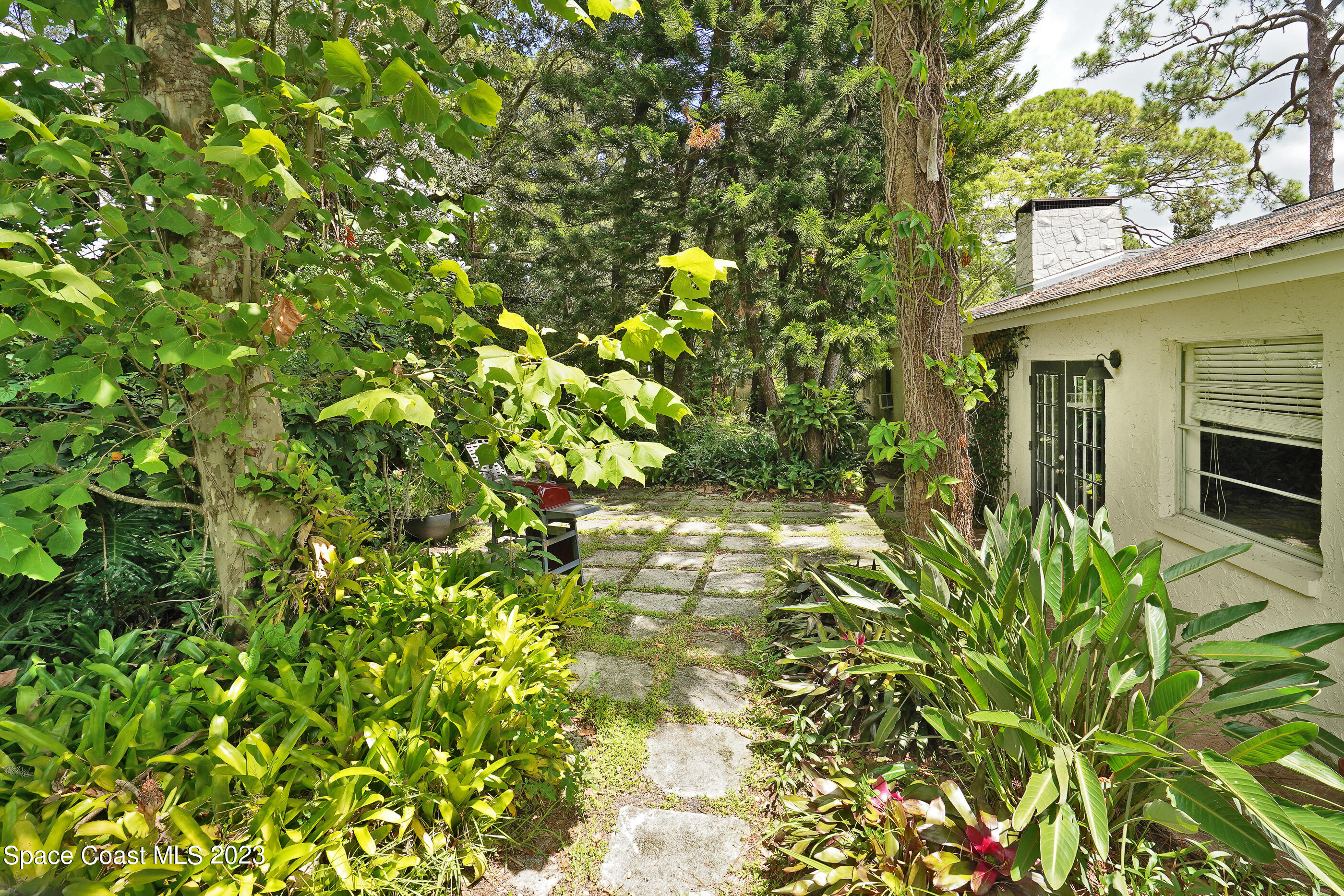 2525 Friday Road Cocoa, FL 32926 - Photo 76 of 77 a backyard of a house with lots of green space