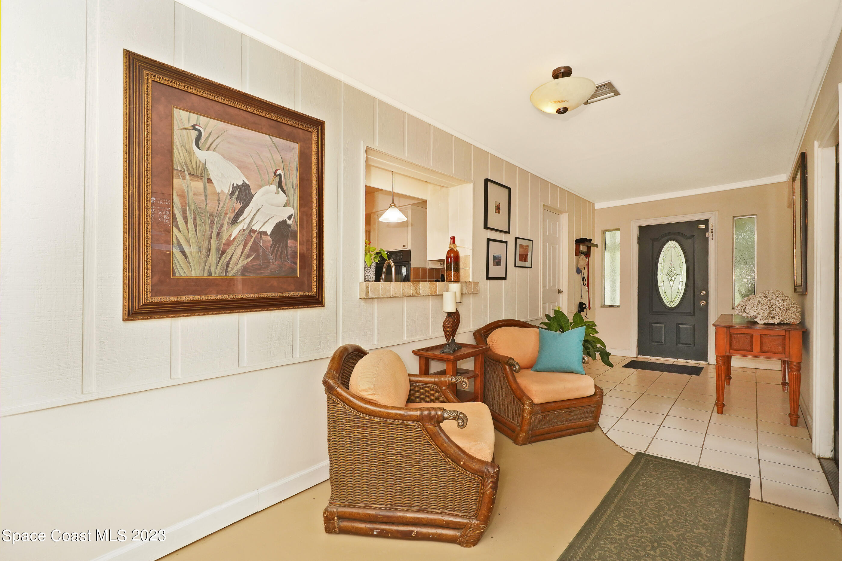 2525 Friday Road Cocoa, FL 32926 - Photo 8 of 77 a living room with furniture and painting on the wall