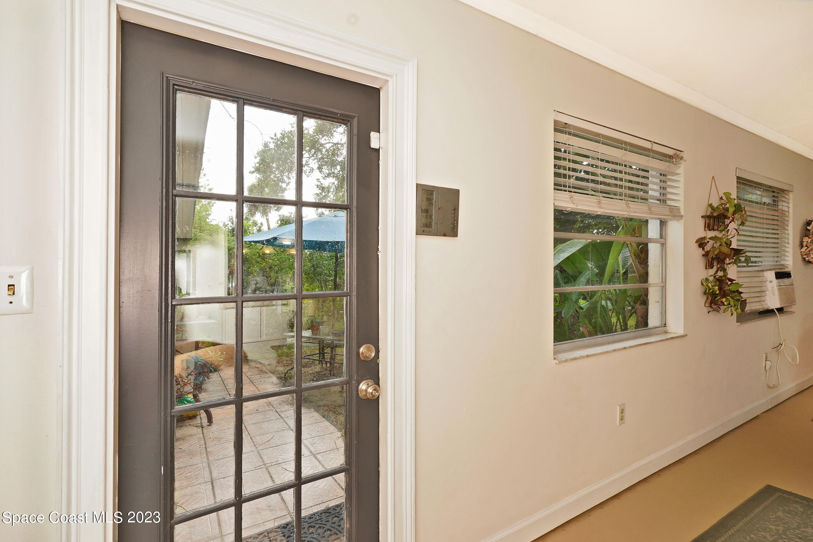 2525 Friday Road Cocoa, FL 32926 - Photo 9 of 77 a view of a glass door and a window