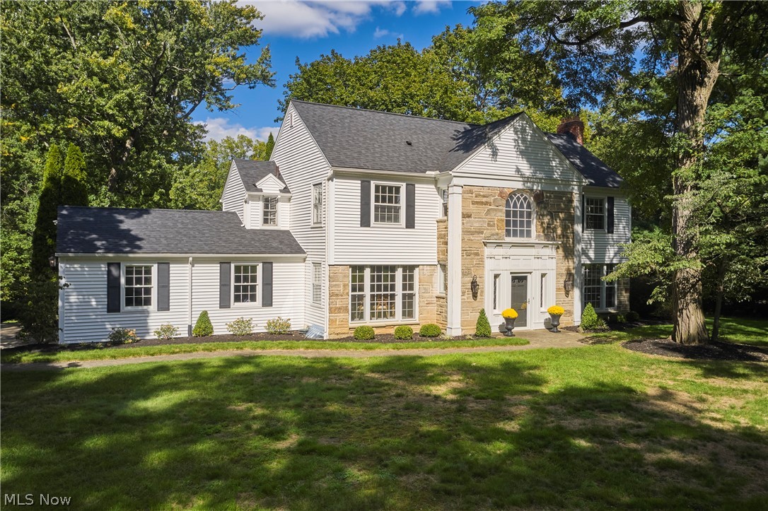 2345 Chatham Road Akron, OH 44313 - Photo 1 of 37 Stately exterior featuring white siding, stone façade accents, dark shingled roof, multiple gables, and prominent front entrance