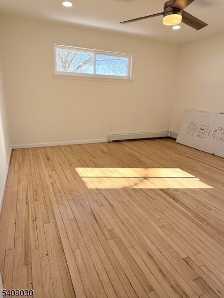 114 North Beverwyck Road, Unit 11 Lake Hiawatha, NJ 07034 - Photo 14 of 17 an empty room with wooden floor and windows