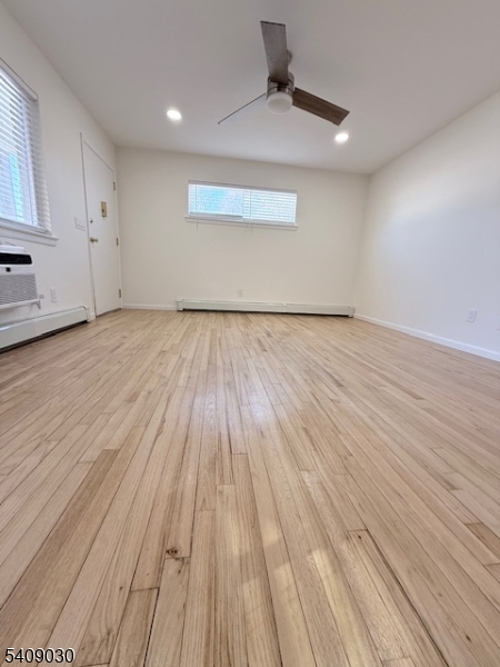 114 North Beverwyck Road, Unit 11 Lake Hiawatha, NJ 07034 - Photo 3 of 17 a view of wooden floor and windows in a room