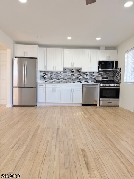 114 North Beverwyck Road, Unit 11 Lake Hiawatha, NJ 07034 - Photo 5 of 17 a kitchen with stainless steel appliances granite countertop a refrigerator sink and stove