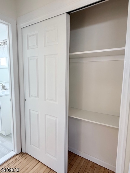 114 North Beverwyck Road, Unit 11 Lake Hiawatha, NJ 07034 - Photo 7 of 17 a view of walk in closet with empty racks