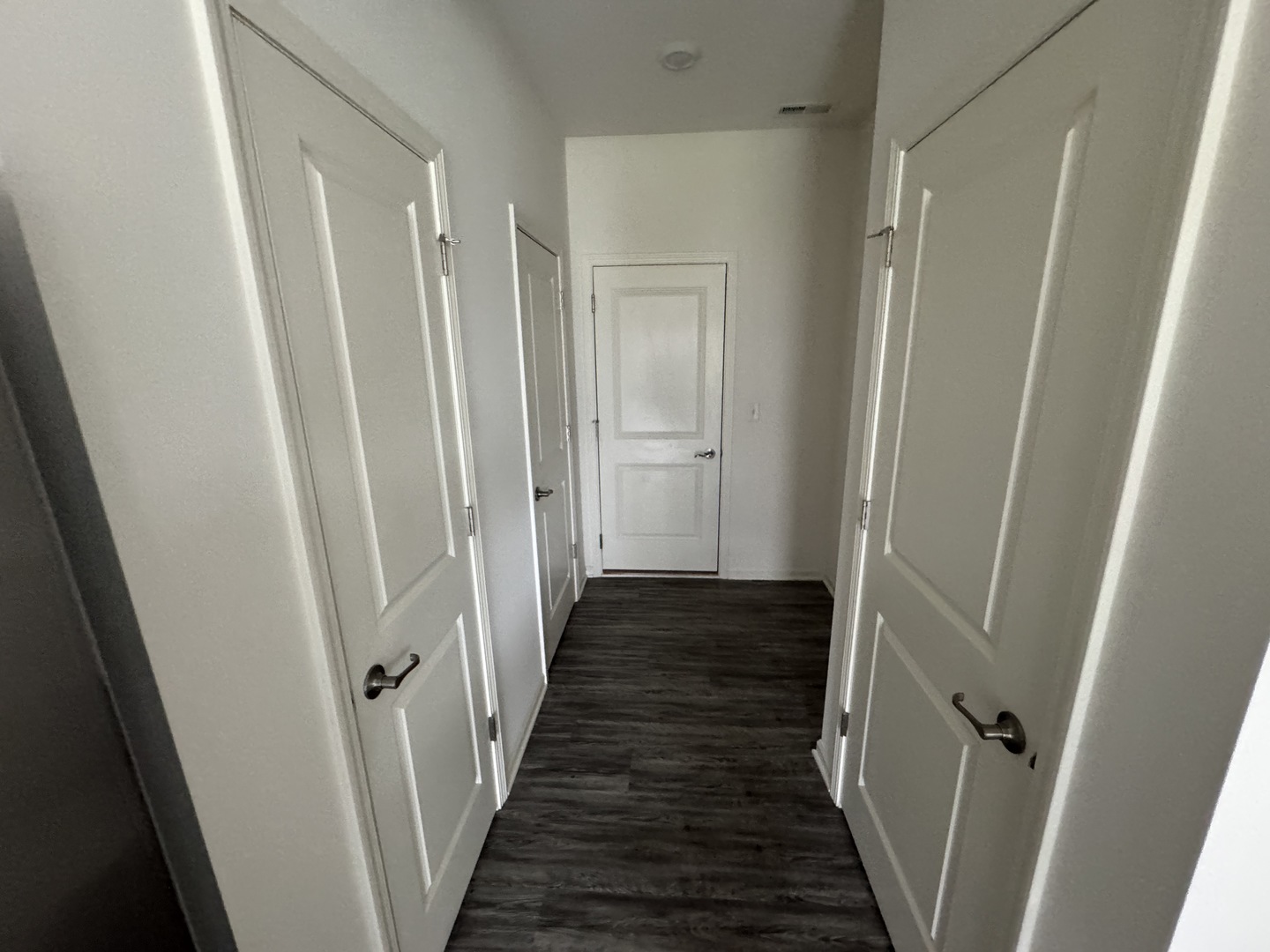 1226 Draper Road McHenry, IL 60050 - Photo 5 of 17 a view of a hallway with wooden floor and staircase