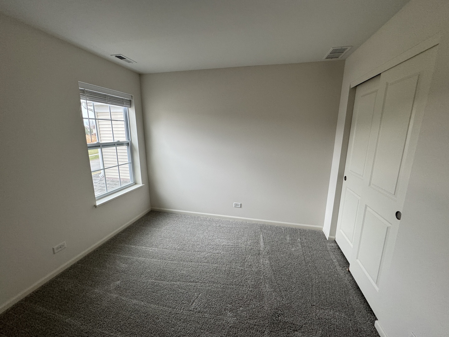 1226 Draper Road McHenry, IL 60050 - Photo 7 of 17 a view of an empty room with a window