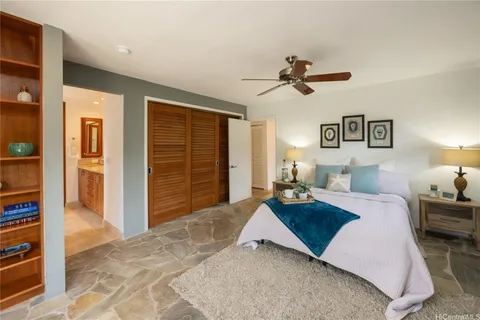 a bedroom with a bed and dresser