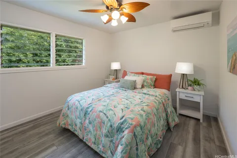 a room with a wooden floor and furniture