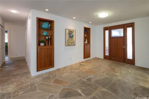 a view of livingroom with furniture and workspace