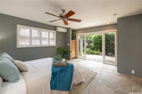 a spacious bedroom with a bed and a walk in closet