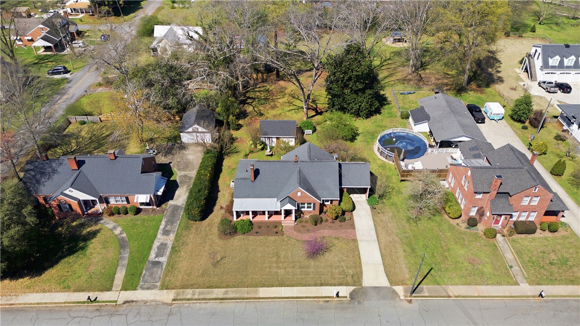 310 Retreat Street Westminster, SC 29693 - Photo 38 of 46 An aerial view captures the charming homes, showcasing a well-maintained property with a delightful above-ground pool.
