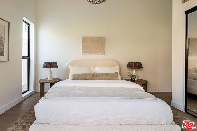 a large white bed in a white room