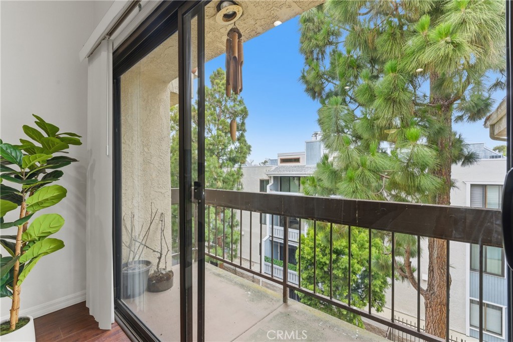 8180 Manitoba Street, Unit 330 Playa del Rey, CA 90293 - Photo 14 of 31 a view of a balcony with wooden floor