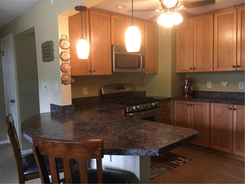 3075 Raintree Drive Gibsonia, PA 15044 - Photo 5 of 24 Custom kitchen with maple cabinetry, five burner gas stove and great eat in area.