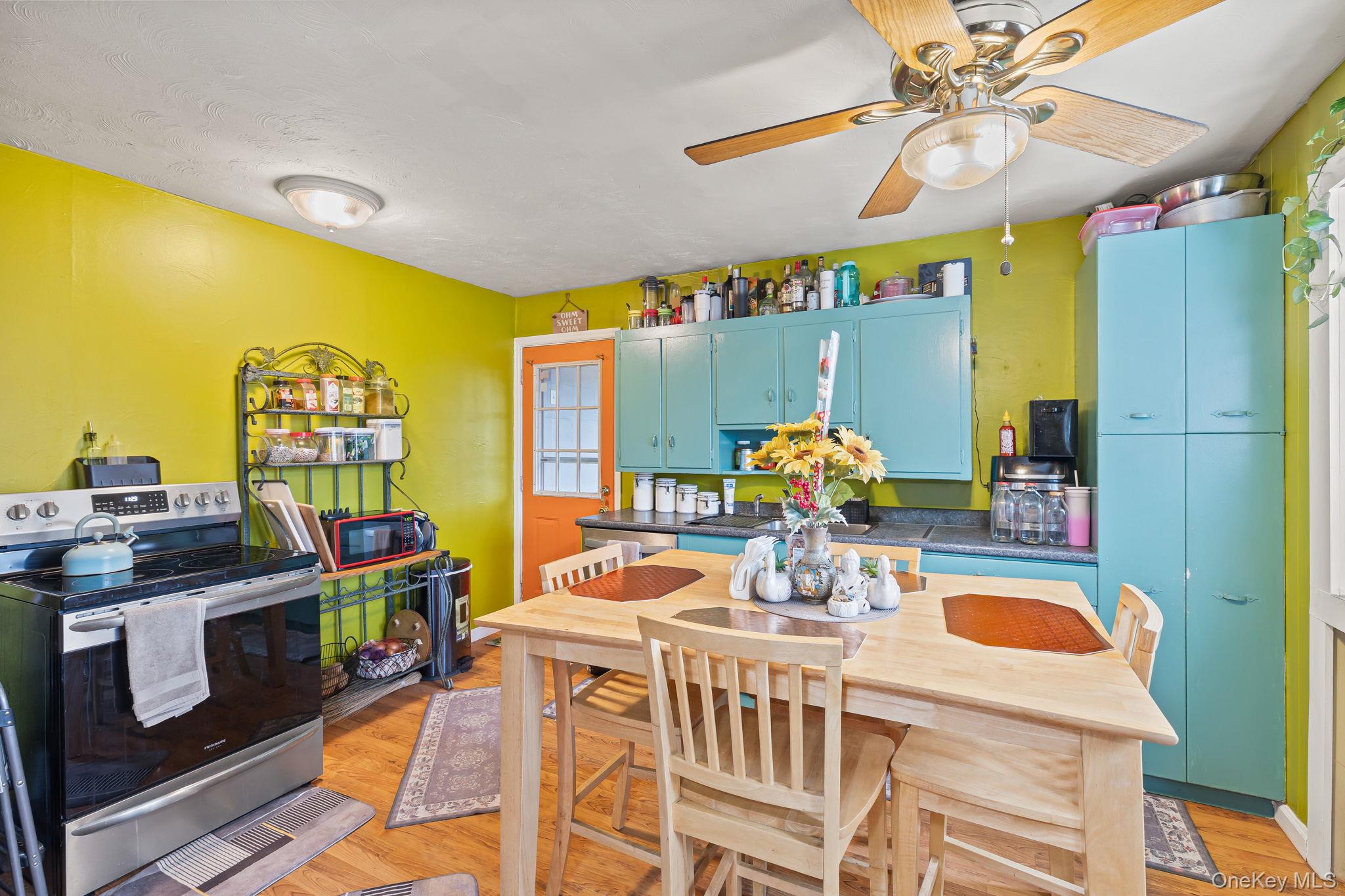 11 Cross Creek Road Cold Spring, NY 10516 - Photo 12 of 43 a dining room filled chandelier and wooden floor