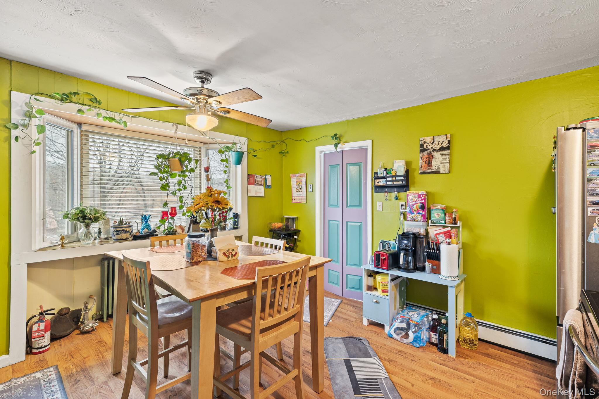 11 Cross Creek Road Cold Spring, NY 10516 - Photo 15 of 43 a view of a dining room with furniture a chandelier and wooden floor