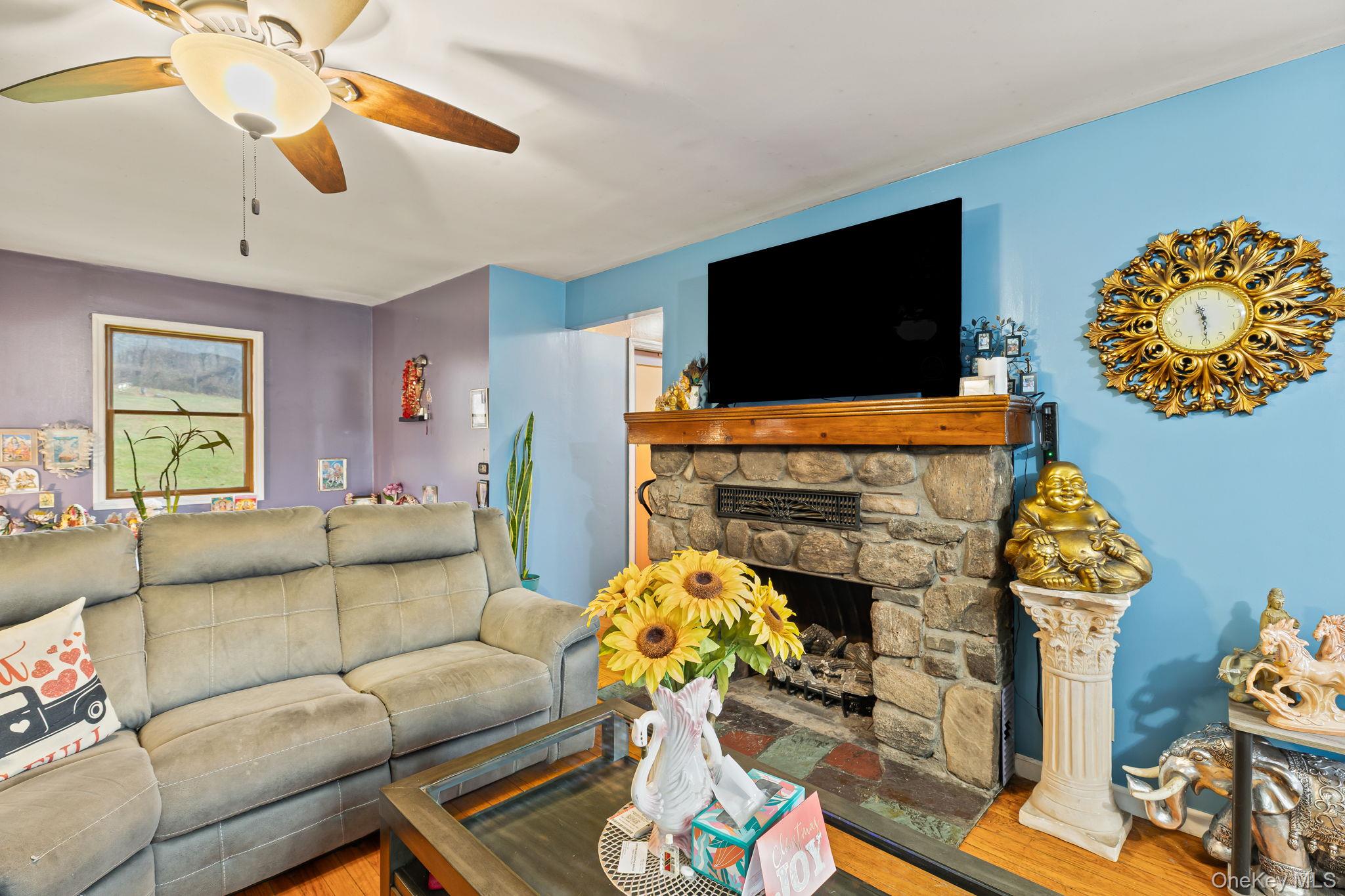 11 Cross Creek Road Cold Spring, NY 10516 - Photo 19 of 43 a living room with furniture and a flat screen tv