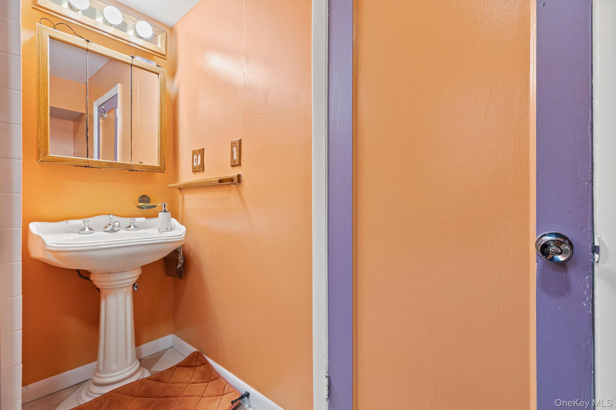 11 Cross Creek Road Cold Spring, NY 10516 - Photo 24 of 43 a bathroom with a sink and mirror