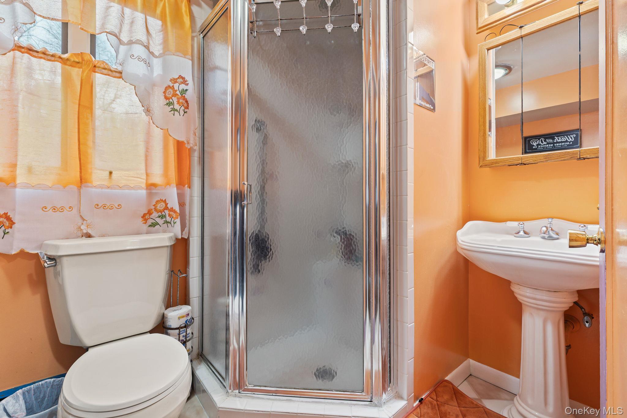 11 Cross Creek Road Cold Spring, NY 10516 - Photo 25 of 43 a white toilet sitting next to a bathroom sink