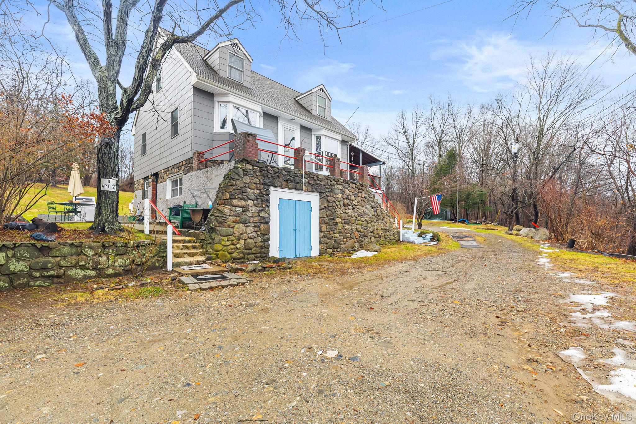 11 Cross Creek Road Cold Spring, NY 10516 - Photo 3 of 43 a view of a building with snow on the road