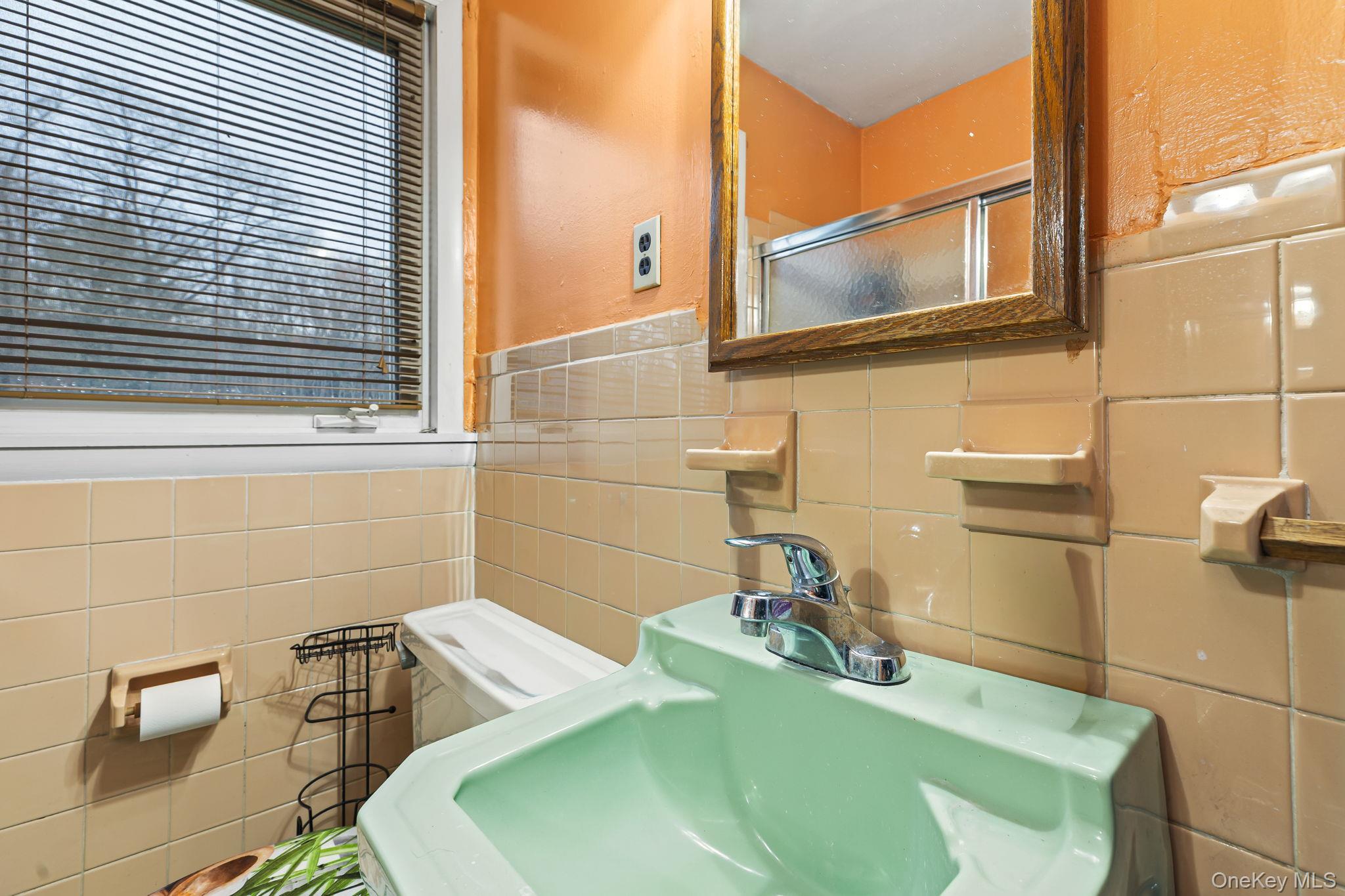 11 Cross Creek Road Cold Spring, NY 10516 - Photo 34 of 43 a bathroom with a sink and a mirror