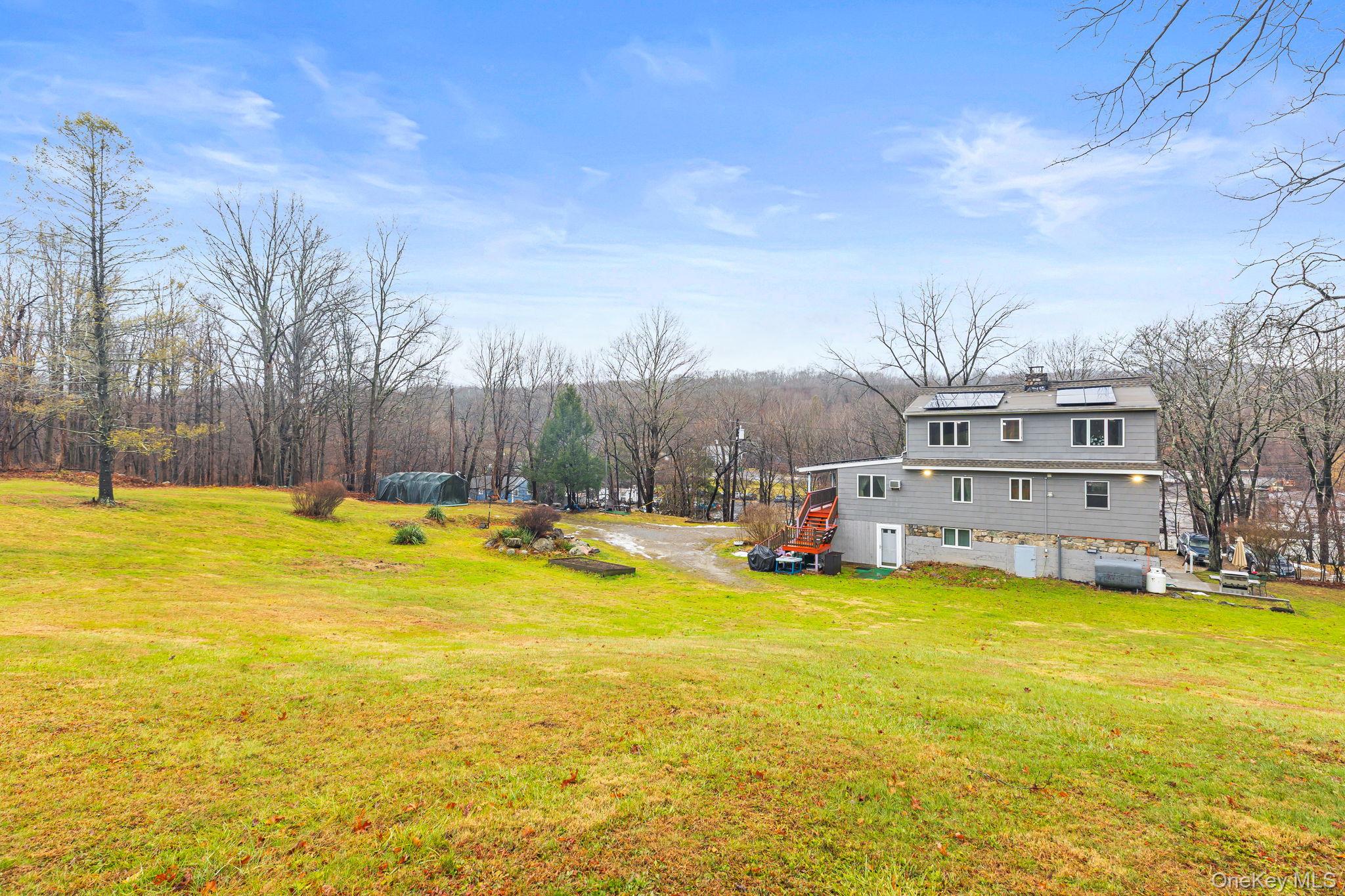 11 Cross Creek Road Cold Spring, NY 10516 - Photo 7 of 43 a view of a swimming pool with an outdoor space and seating area