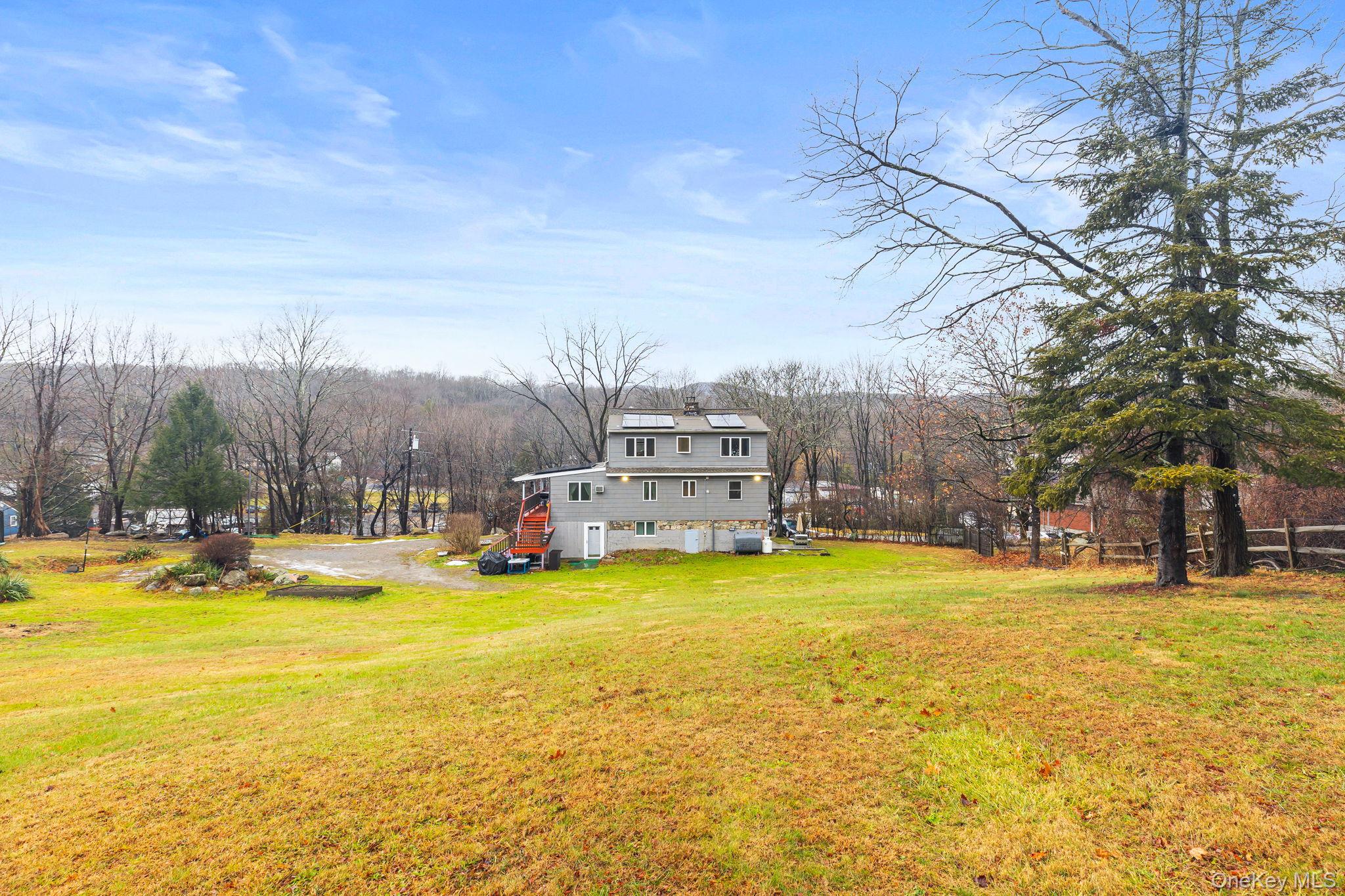 11 Cross Creek Road Cold Spring, NY 10516 - Photo 8 of 43 a view of a house with swimming pool and a yard with trees