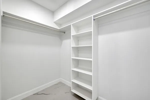 a view of an empty walk in closet