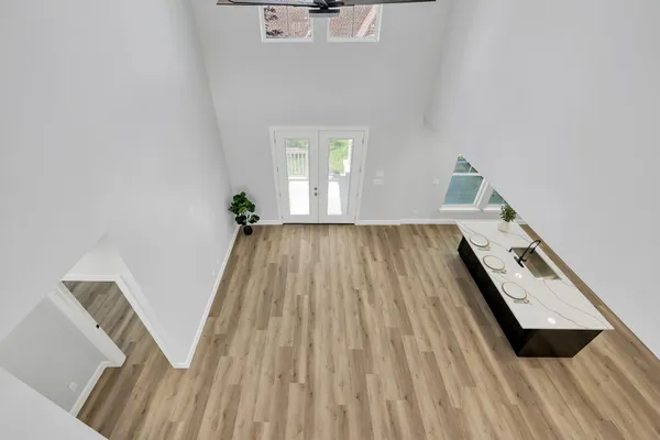 a view of a hardwood floor in a room