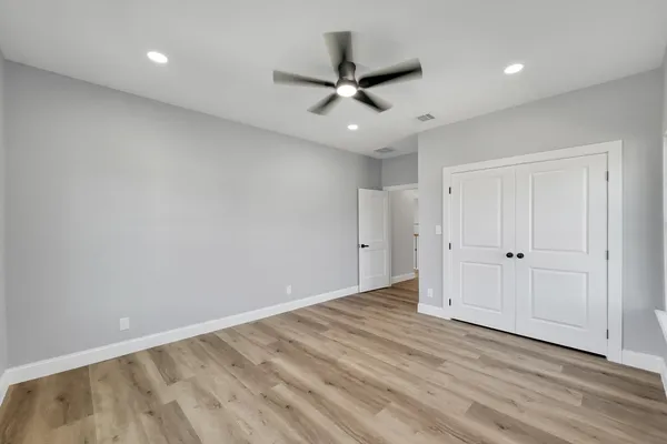 a bathroom with a toilet a sink and shower