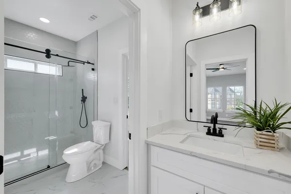 an aerial view of a house with a yard