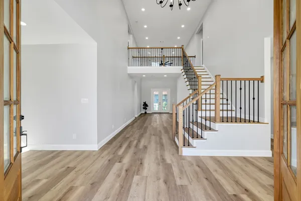 a view of entryway with wooden floor