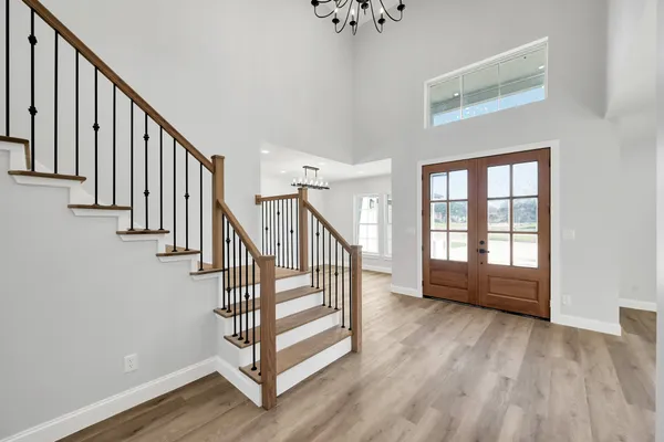 a view of an entryway with wooden floor