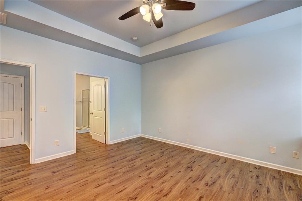 505 Riverview Lane Canton, GA 30114 - Photo 13 of 34 a view of an empty room with wooden floor