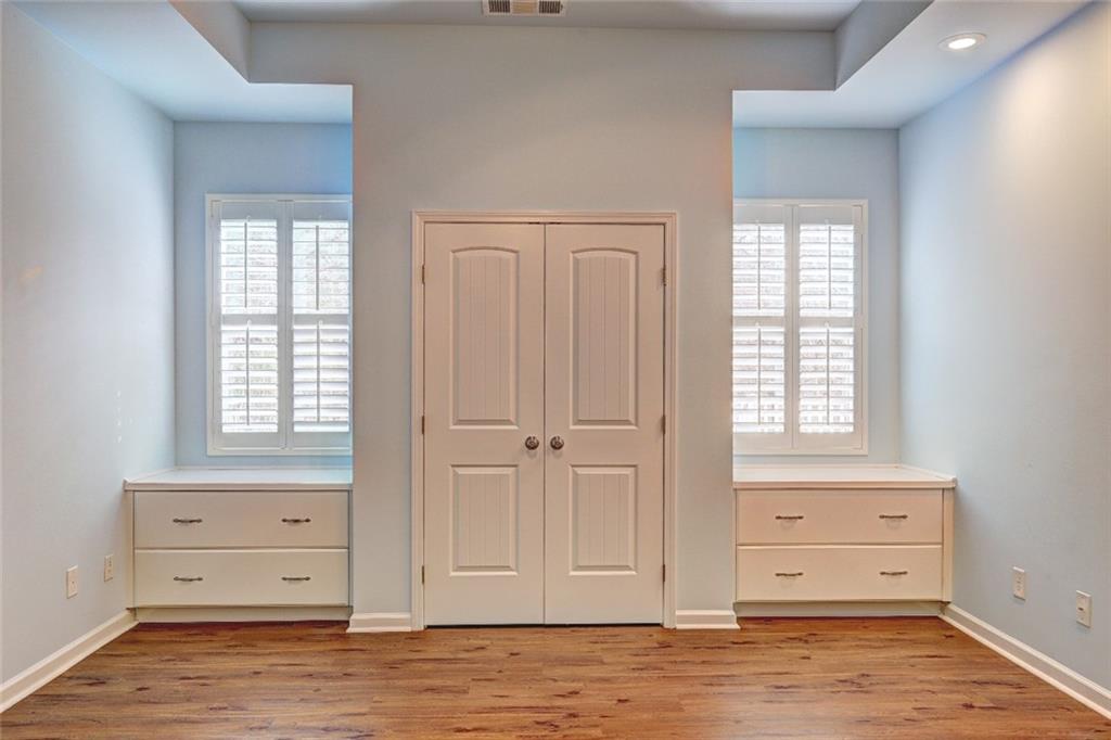 505 Riverview Lane Canton, GA 30114 - Photo 15 of 34 an empty room with windows and cabinet