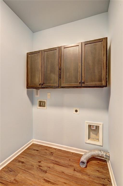 505 Riverview Lane Canton, GA 30114 - Photo 20 of 34 a view of a livingroom with wooden cabinets