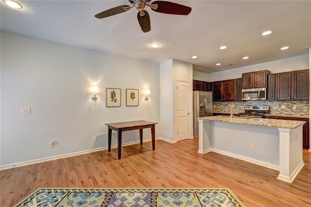 505 Riverview Lane Canton, GA 30114 - Photo 6 of 34 a kitchen with stainless steel appliances granite countertop a refrigerator and a stove top oven