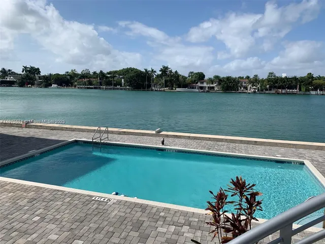 a view of a lake with a big yard
