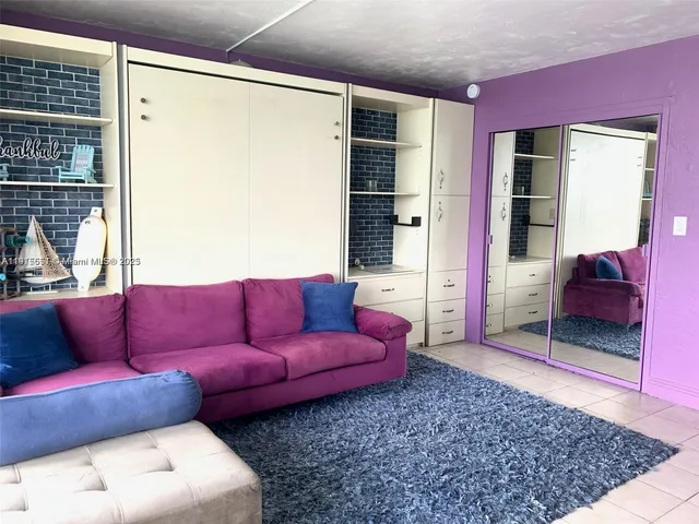 a living room with furniture and a rug